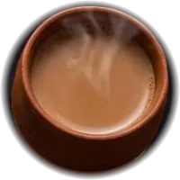 Steaming chai in a small clay cup