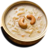Creamy vermicelli pudding with cashews in a brass bowl