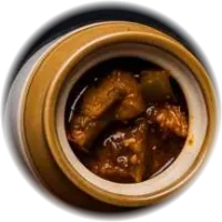 Spiced pickle in a small glazed jar