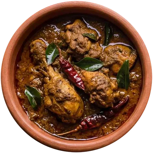 Dark dry-roasted chicken with curry leaves and dried red chillies in a terracotta pot